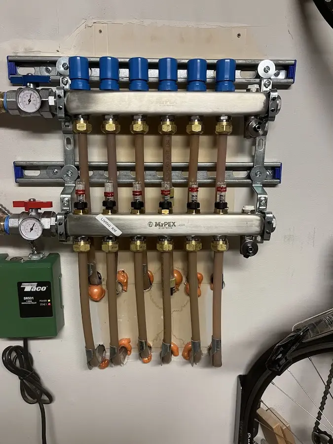 Plumber performing Water Heater Repair at a residential property in Bath